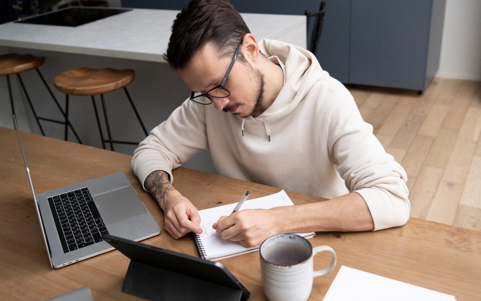 Business owner reviewing budget documents with advisor in Belconnen office